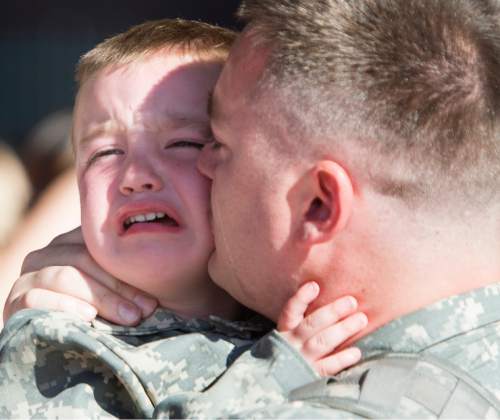 Rick Egan  |  The Salt Lake Tribune

Timothy Schaumkel says good bye to his 2-year-old son, Jackson, before he and other  soldiers of the 116th Engineer Company (Horizontal), Utah National Guard, left for Kuwait  from the Roland Wright
Air Base in Salt Lake City, Sunday, October 4, 2015.