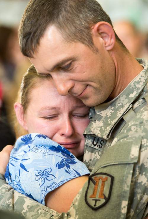 Rick Egan  |  The Salt Lake Tribune

Virginia Brewer hugs her brother Jason Marshall, Roosevelt, before he boarded the plane with other soldiers of the 116th Engineer Company (Horizontal), Utah National Guard, left for Kuwait  from the Roland Wright Air Base in Salt Lake City, Sunday, October 4, 2015.