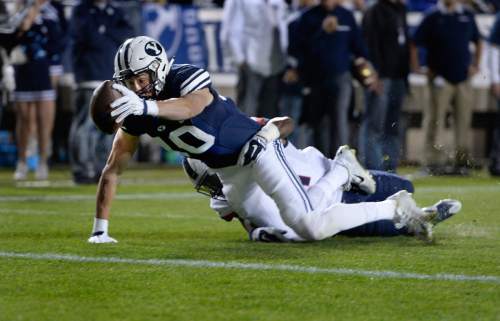 Scott Sommerdorf   |  The Salt Lake Tribune
BYU wide receiver Mitch Mathews (10) reaches for the goal line but comes up short during first half play. BYU later scored to take an early 7-0 lead. UCONN and BYU were tied 7-7 at the half, October 2, 2015.