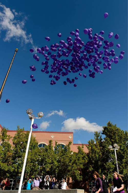 Trent Nelson  |  The Salt Lake Tribune
296 balloons are released on Tuesday in Sandy, symbolizing the adult victims of the past year and in recognition of Domestic Violence Month.