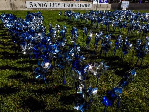 Trent Nelson  |  The Salt Lake Tribune
401 pinwheels in recognition of 401 child victims of domestic violence last year were planted on the lawn in front of the Sandy City Justice Center to mark Domestic Violence Month, Tuesday October 6, 2015.