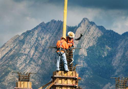 Steve Griffin  |  The Salt Lake Tribune

Mount Olympus looms in the background as construction continues on the Overstock Peace Coliseum in Midvale, Monday, October 5, 2015.