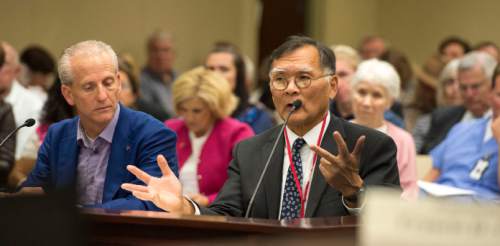 Steve Griffin  |  The Salt Lake Tribune

Senate President Wayne Niederhauser, left, listens as Sen. Brian E. Shiozawa, R-Salt Lake City, addresses the Health Reform Task Force during a meeting to discuss where Utah is at on covering low-income residents falling in the current insurance gap. The meeting was held at the House Building on capitol hill 
in Salt Lake City, Tuesday, October 6, 2015.