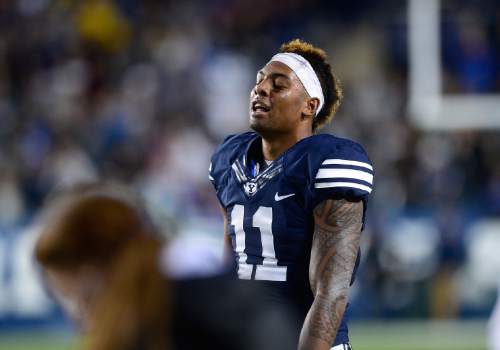 Scott Sommerdorf   |  The Salt Lake Tribune
BYU wide receiver Terenn Houk (11) shows some relief on his face after a TD catch by team mate BYU wide receiver Mitch Mathews (10) helped stretch BYU's lead. BYU beat UCONN 30-13, Friday, October 2, 2015.