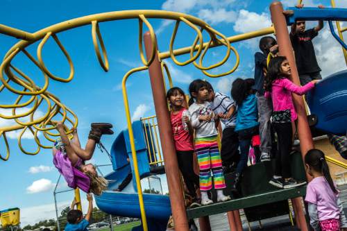 Chris Detrick  |  The Salt Lake Tribune
First graders in Sydney Johnson's class play on the playground during recess at Lincoln Elementary School Tuesday October 6, 2015.