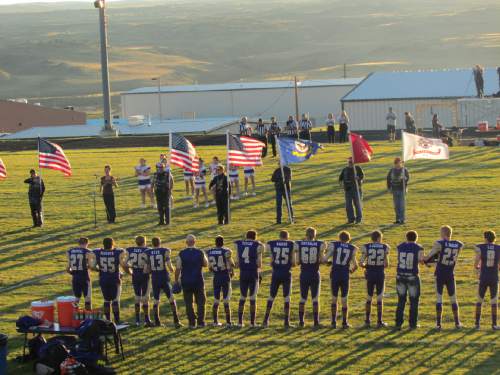 Tom Wharton  |  The Salt Lake Tribune

Flag ceremony at Wayne High football homecoming.