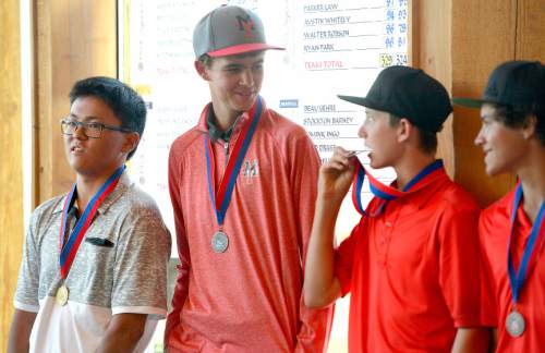 Leah Hogsten  |  The Salt Lake Tribune
Manti's Davis Hardy (center) laughs at the antics of Grand County's Masen Ward who bites his third place medal as if it is an Olympic medal Thursday, October 8, 2015 during the 2A Boys State Championship awards. At left is Rowland Hall's Garret Furubayashi, who took first place.