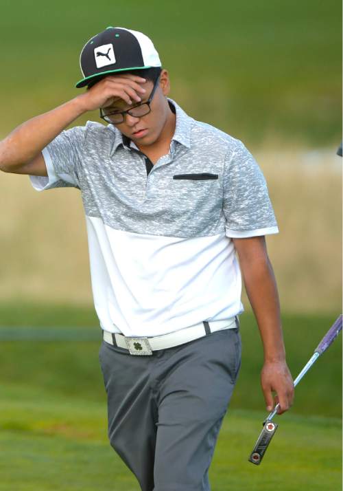 Leah Hogsten  |  The Salt Lake Tribune
Garret Furubayashi of Rowland Hall reacts to his play Thursday, October 8, 2015 while walking off the 18th green after winning the 2A Boys State Championship after his two-hole playoff with Manti's Davis Hardy.
