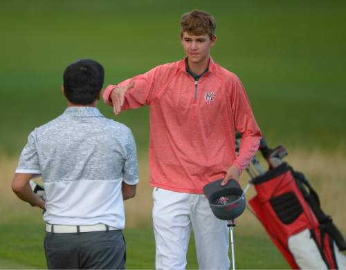 Leah Hogsten  |  The Salt Lake Tribune
l-r Garret Furubayashi of Rowland Hall and Manti's Davis Hardy shake hands after meeting on the 18th green for the second time Thursday, October 8, 2015 for a two-hole playoff. Furubayashi won the 2A Boys State Championship and Hardy took second.