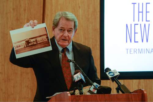 Francisco Kjolseth | The Salt Lake Tribune
Mickey Gallivan, Chair of the Salt Lake City International Airport, holds up a photo taken they day his father attended the visit by Charles Lindbergh to Salt Lake with the Spirit of St. Louis in 1927. Officials and Mayor Ralph Becker release images and video detailing interior and exterior views of the new airport terminal. The $1.8 billion project is expected complete in 2023.