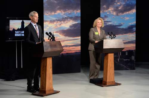 Scott Sommerdorf   |  The Salt Lake Tribune
Mayoral candidates Ralph Becker and Jackie Biskupski get settled at their podiums just after they were ushered into the television studio at KUED for the SLC mayor's debate, Thursday, October 8, 2015.