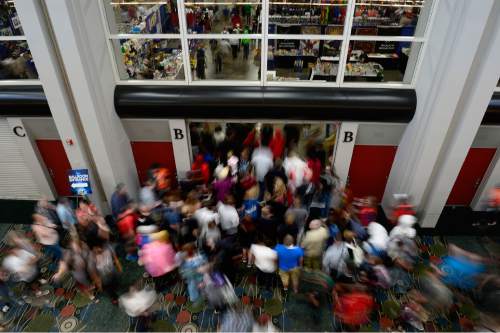 Scott Sommerdorf   |  The Salt Lake Tribune
People stream into the main convention hall as they doors are opened at the opening day of Comic Con in Salt Lake City, Thursday, September 23, 2015.