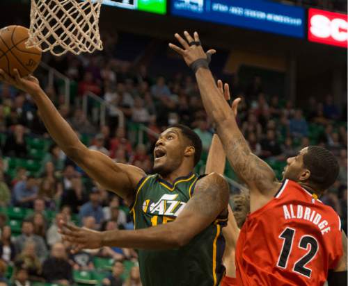 Rick Egan  |  The Salt Lake Tribune

Utah Jazz forward Derrick Favors (15) goes to the hoop, as Minnesota Timberwolves guard Gary Neal (12) defends in NBA action, Utah Jazz vs. The Portland TrailBlazers, at the EnergySolutions Arena, Wednesday, March 25, 2015.