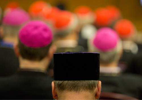 Prelates pray before the opening of a morning session of the Synod of bishops, at the Vatican, Tuesday, Oct. 6, 2015. (AP Photo/Alessandra Tarantino)