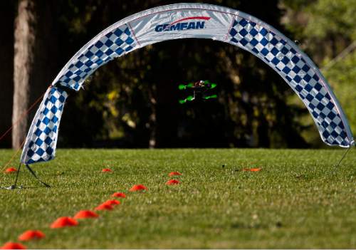 Michael Mangum  |  Special to the Tribune
A drone flys under an arch obstacle during the first Utah Cup drone race at Warm Springs Park in Salt Lake City on Saturday. Some racing drones can fly as fast as 60 miles per hour.