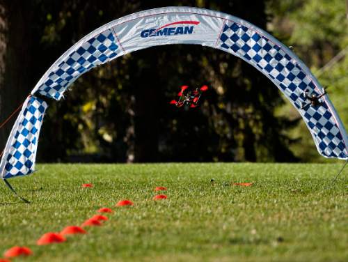 Michael Mangum  |  Special to the Tribune

Remote controlled drones fly underneath an arch obstacle during the first Utah Cup drone race at Warm Springs Park in Salt Lake City, UT on Saturday, October 10, 2015. Some of these racing drones can reach as fast as 60 miles per hour.
