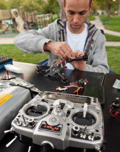 Michael Mangum  |  Special to the Tribune
Tyler Christensen, of Alpine, assembles an Airborne Racing Grand Prix 250mm class drone before the beginning of the first Utah Cup drone race at Warm Springs Park in Salt Lake City on Saturday.