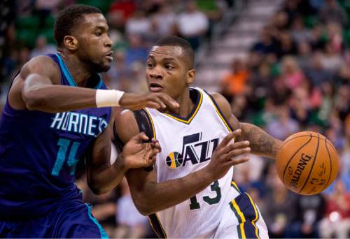 Lennie Mahler  |  The Salt Lake Tribune
Elijah Millsap drives to the basket past Michael Kidd-Gilchrist in the first half as the Utah Jazz face the Charlotte Hornets at EnergySolutions Arena on Monday, March 16, 2015.