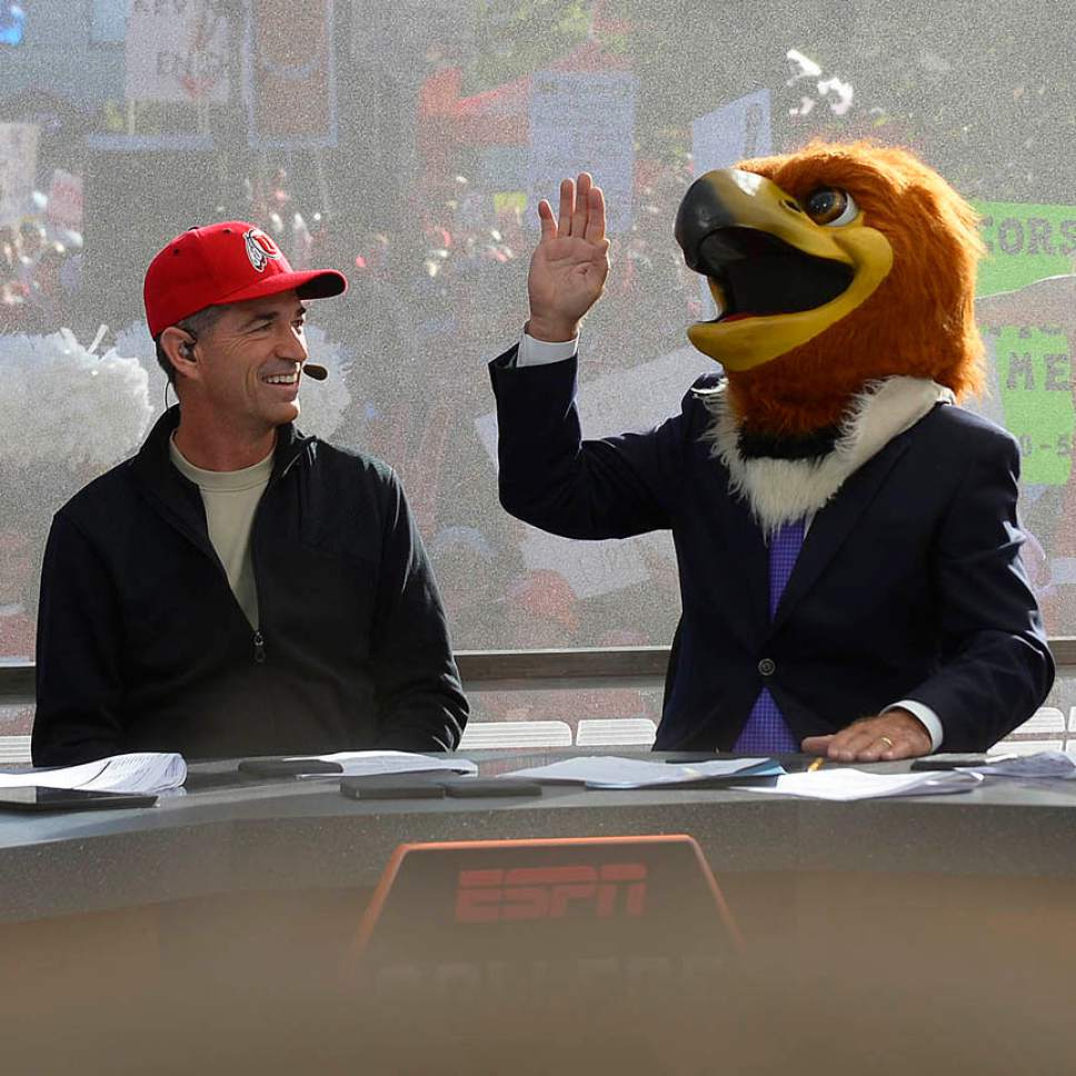 Leah Hogsten  |  The Salt Lake Tribune
l-r ESPN's "College GameDay," cast Rece Davis, local celebrity John Stockton, Lee Corso and Kirk Herbstreit laugh as Corso places the head of Swoop, Utah's mascot, on his head, predicting the Utes will win the game. Hundreds of fans cheered for their teams Saturday, October 10, 2015, at The University of Utah's President's Circle, during the filming of ESPN's "College GameDay," a sports television show that previews and predicts winners of the nation's college football games and picked No. 5 Utah to beat No. 23 Cal.