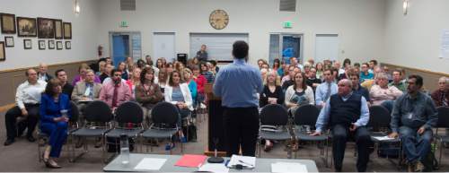 Steve Griffin  |  The Salt Lake Tribune

Parents, teachers and administrators listen as representatives from the Utah State Office of Education hold an informational meeting on the new Science Core Standards in Provo, Utah Wednesday, May 6, 2015.