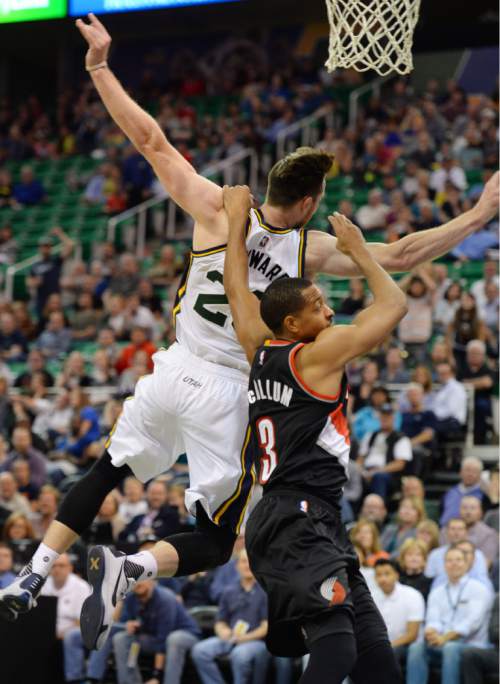 Steve Griffin  |  The Salt Lake Tribune

Utah Jazz guard Gordon Hayward (20) gets pulled down from behind by Portland Trail Blazers guard C.J. McCollum (3) late in the second half of the Utah Jazz versus the Portland Trailblazers preseason NBA basketball game at EnergySolutions Arena in Salt Lake City, Monday, October 12, 2015. McCollum was called for a flagrant foul and ejected from the game.
