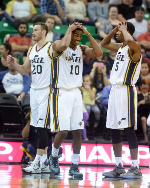 Steve Griffin  |  The Salt Lake Tribune

Utah Jazz guard Alec Burks (10) and Utah Jazz guard Rodney Hood (5) hold their heads in their hands  after the Trailblazers made a basket late in the game at EnergySolutions Arena in Salt Lake City, Monday, October 12, 2015.