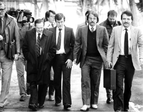 |  Tribune file photo

Ron Yengich (wearing white boots) walks to court with Mark Hofmann (center) for court proceedings in Salt Lake City..