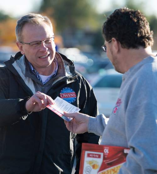 Rick Egan  |  Tribune file photo

Congressional candidate Doug Owens visits with Patrick McLaughlin as he campaigned in a shopping center in West Jordan in the 2014 election