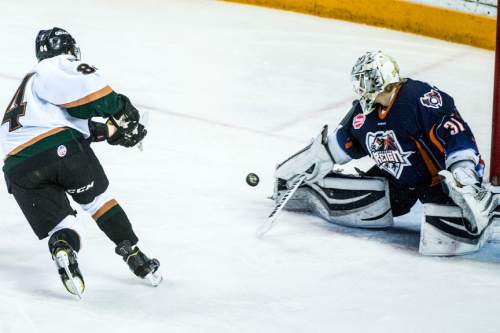 Chris Detrick  |  The Salt Lake Tribune
Ontario Reign's Jussi Olkinuora (31) makes a save from Utah Grizzlies' T.J. Syner (84) during game 5 of the ECHL playoff series at the Maverik Center Saturday May 9, 2015.