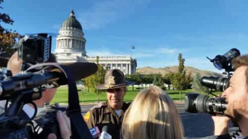 Lennie Mahler  |  The Salt Lake Tribune
UHP Cpt. Barton Blair speaks to the media about a suspicious package left in the Capitol Rotunda by a man wearing a blue or black suit on Thursday in Salt Lake City. The Capitol Building was evacuated during the bomb squad investigation.
