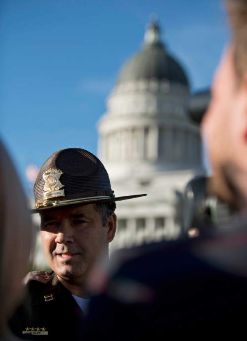 Lennie Mahler  |  The Salt Lake Tribune

UHP Captain Barton Blair speaks to the media about a suspicious package found in the Utah State Capitol Building on Thursday, Oct. 15, 2015. An unloaded semi-automatic rifle was later found in the package, which caused an evacuation of the building Thursday.