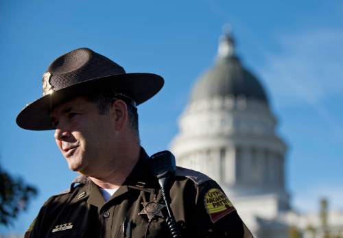 Lennie Mahler  |  The Salt Lake Tribune

UHP Captain Barton Blair speaks to the media about a suspicious package found in the Utah State Capitol Building on Thursday, Oct. 15, 2015. An unloaded semi-automatic rifle was later found in the package, which caused an evacuation of the building Thursday.