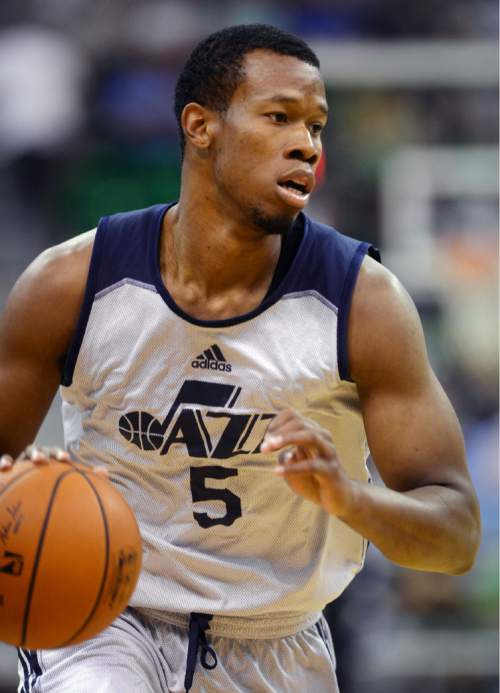 Steve Griffin  |  The Salt Lake Tribune


Utah's Rodney Hood drives into the lane during the Utah Jazz Summer League game between the Jazz and the San Antonio Spurs at EnergySolutions Arena in Salt Lake City, Tuesday, July 7, 2015.