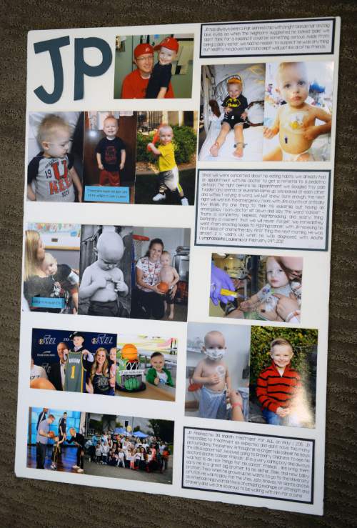 Steve Griffin  |  The Salt Lake Tribune

 A poster shows the timeline of J.P. Gibson's cancer battle. Gibson captured the hearts of many when the 5-year-old got the chance to participate in a Utah Jazz scrimmage last season. A year later, the Layton boy is cancer free. Wednesday, September 30, 2015.