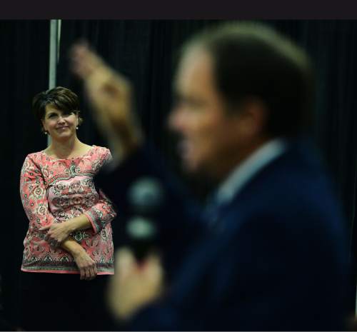 Steve Griffin  |  The Salt Lake Tribune

Tami Pyfer, Education Advisor, for Gov. Gary Herbert listens to the governor speak as he attends the Hot Topics and Hot Dogs discussion at the Annual Utah Education Association Convention & Education Exposition at the South Towne Expo Center in Sandy, Thursday, October 15, 2015.