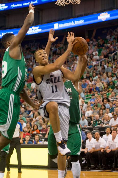 Rick Egan  |  The Salt Lake Tribune

C.J. Fair (49) defends for Boston, as Utah Jazz guard Dante Exum (11) takes the ball to the hoop, in Utah Jazz Summer League action, Utah Jazz vs. The Boston Celtics, at EnergySolutions Arena, Monday, July 6, 2015.