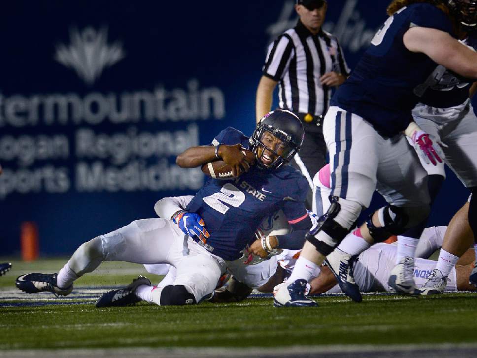 Scott Sommerdorf   |  The Salt Lake Tribune
Utah State Aggies QB Kent Myers (2) is brought down after he was flushed from the pocket during first quarter play. Utah State led Boise State 17-3 after one quarter of play, Friday, October 15, 2015.