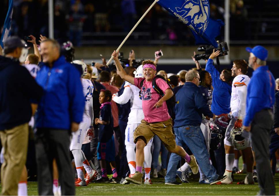 Scott Sommerdorf   |  The Salt Lake Tribune
USU Aggie fans storm the field after Utah State defeated Boise State 52-26 in Logan, Friday, October 15, 2015.