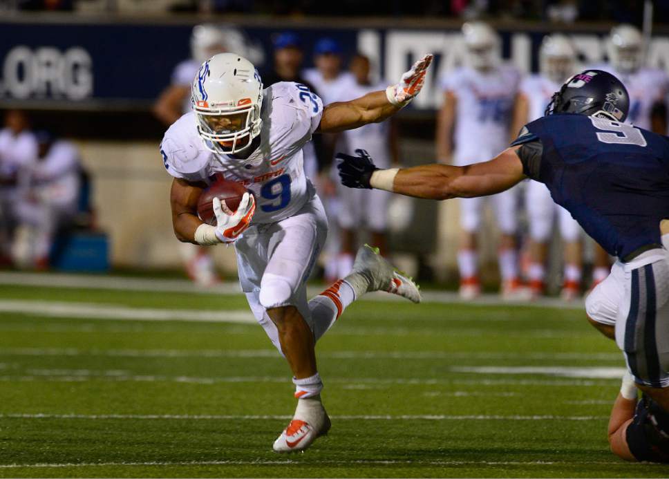 Scott Sommerdorf   |  The Salt Lake Tribune
Boise State Broncos RB Kelsey Young (39) runs the ball against Utah State Aggies LB Kyler Fackrell (9) as Utah State defeated Boise State 52-26 in Logan, Friday, October 15, 2015.