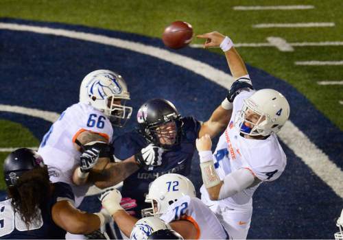 Scott Sommerdorf   |  The Salt Lake Tribune
Boise State Broncos QB Brett Rypien (4) is forced into what at first was ruled a fumble, but later ruled an incompletion after review. Utah State led Boise State 45-10 at the half, Friday, October 15, 2015.