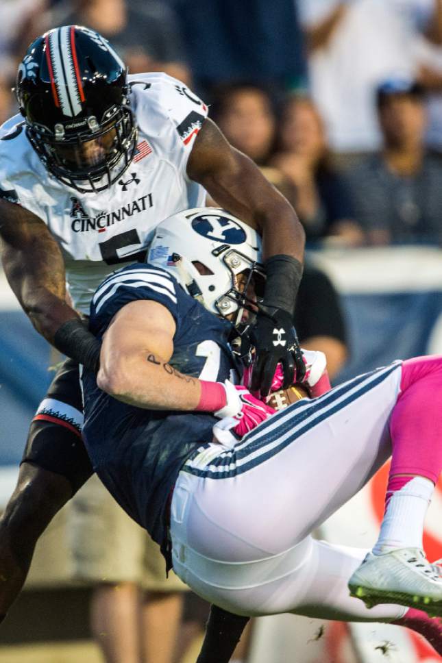 Chris Detrick  |  The Salt Lake Tribune
Brigham Young Cougars wide receiver Mitch Mathews (10) makes a catch past Cincinnati Bearcats safety Mike Tyson (5) during the game at LaVell Edwards Stadium Friday October 16, 2015.