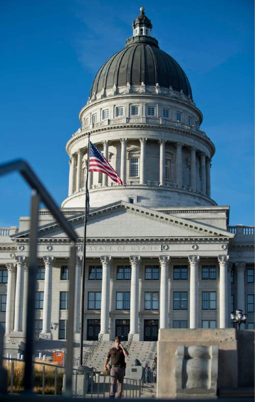 Lennie Mahler  |  The Salt Lake Tribune

UHP officers patrol the Utah State Capitol after a suspicious package was found in the buliding on Thursday, Oct. 15, 2015. An unloaded semi-automatic rifle was later found in the package, which caused an evacuation of the building Thursday.