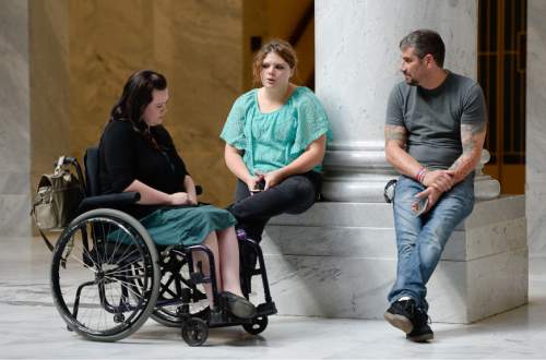 Francisco Kjolseth | Tribune file photo
Representing the tens of thousands of low-income Utahns in need of help, Stacy Stanford, left, is joined by Kylie Toponce who has already filed for bankruptcy at 24 years old and might have Crohn's disease and Dan Davidson, who's in long term recovery. The three gathered at the Utah Capitol on Tuesday, Oct. 13, 2015, anxiously awaiting news as the House Republican Caucus went into a closed-door session to take a straw vote on the latest Medicaid-expansion plan, Utah Access Plus. The House GOP soundly rejected the plan.