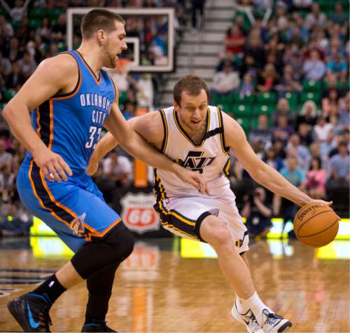 Lennie Mahler  |  The Salt Lake Tribune

Joe Ingles drives around Mitch McGary in the first half of a game between the Utah Jazz and Oklahoma City Thunder at EnergySolutions Arena on Saturday, March 28, 2015.