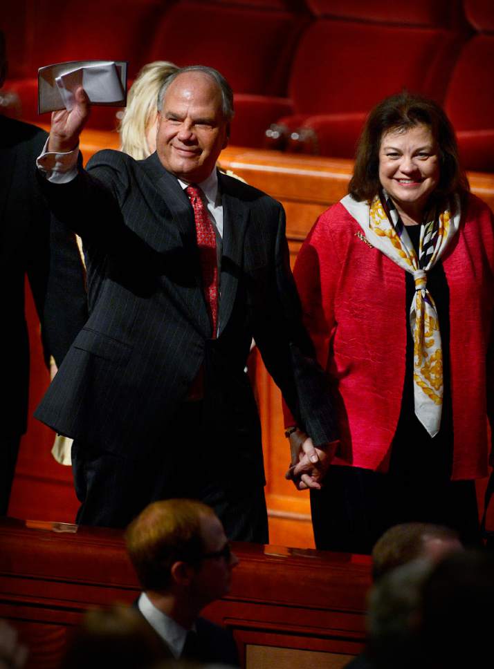 Scott Sommerdorf   |  The Salt Lake Tribune
Elder Ronald A. Rasband leaves the morning session of the 185th Semiannual General Conference with his wife Melanie Rasband, Sunday, October 4, 2015.