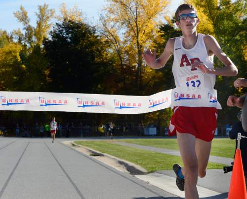 Scott Sommerdorf  |  The Salt Lake Tribune
Zac Jacklin of American Fork crosses the finish line in 15:05.5 to win the boys' 5A race at the Utah State cross-country races held at Sugar House Park and Highland H.S., Wednesday, October 22, 2014. His teammate, Casey Clinger, finished second in 15:12.1. Four American Fork runners finished in the top five.