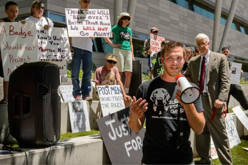 Trent Nelson  |  The Salt Lake Tribune
Sean Kendall speaks as twenty people and a few pets ralliy outside Salt Lake City police headquarters on Thursday who sympathize with dog owner Kendall and are calling for accountability from the department and the officer who fatally shot Kendall's Weimaraner one year ago.