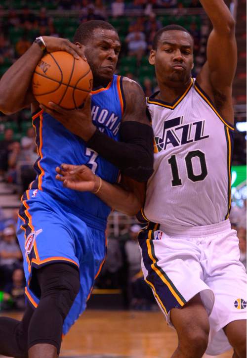 Leah Hogsten  |  The Salt Lake Tribune
Utah Jazz guard Alec Burks (10) pressures Oklahoma City Thunder guard Dion Waiters (3) as they run down the court. Oklahoma City Thunder defeated the Utah Jazz  113-102, Tuesday, October 20, 2015 at Energy Solutions Arena.
