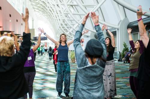 Chris Detrick  |  The Salt Lake Tribune
Morgane Scheffer, of France, center, dances with Uniting Flash Mob during the Parliament of the World's Religion at the Salt Palace Convention Center on Saturday.