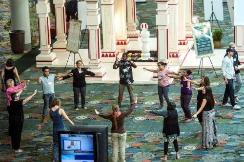 Chris Detrick  |  The Salt Lake Tribune
Dancers with Uniting Flash Mob dance during the Parliament of the World's Religion at the Salt Palace Convention Center Saturday October 17, 2015.